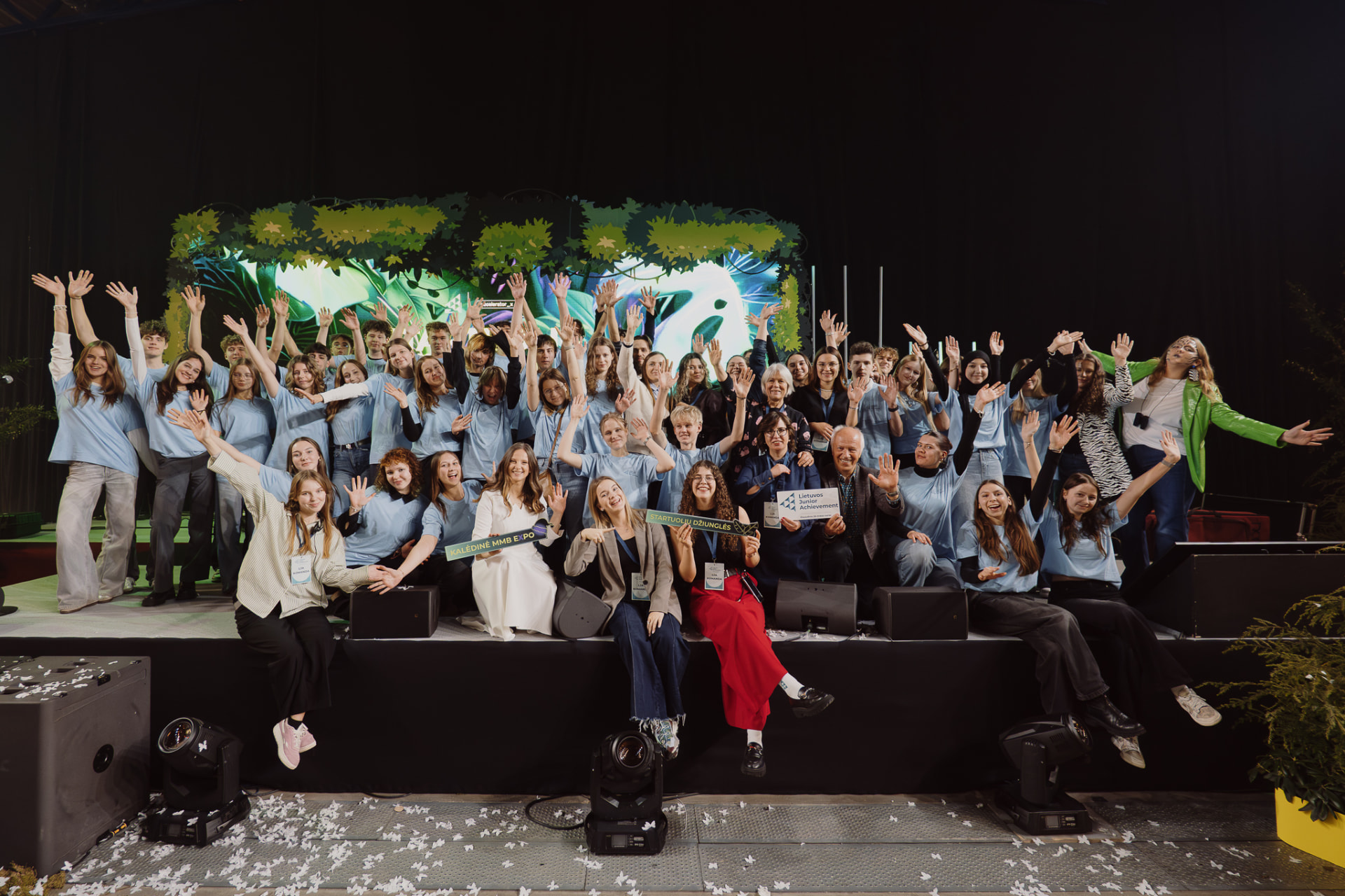 Young student entrepreneurs celebrating on stage at the Christmas MMB Expo